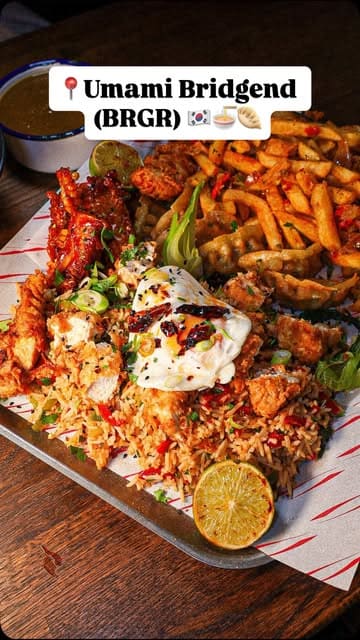 A review of the Korean-inspired menu at Umami Bridgend (BRGR), featuring a large sharing platter, ramen, and milkshakes. The creator provides commentary on the flavours and quality of the dishes.