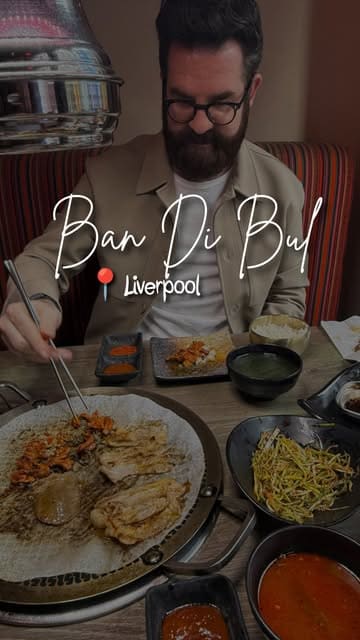 A review of a Korean BBQ restaurant in Liverpool, featuring two creators trying the seven-meat barbecue selection and various side dishes.