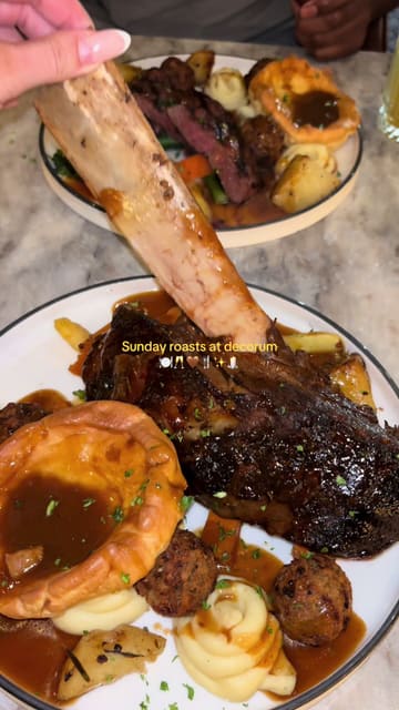 A creator visits Decorum for a Sunday roast, showcasing the venue's ornate interior, cocktails, and the main course.