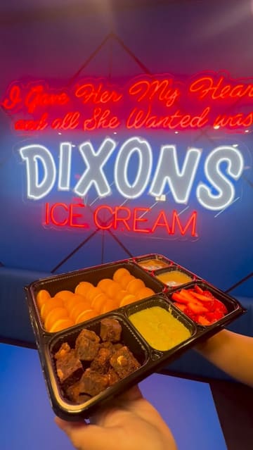A montage video showcasing various dessert items at Dixons Milk Ices, including a pancake sharing tray, knafah cups, and a matcha milkshake. The video features close-up shots of the food and the venue's interior.