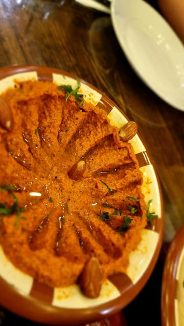 A vlog-style review of an Iftar buffet at Bab Tooma in Bradford, showcasing the venue's atmosphere, the variety of dishes available, and the creator's positive experience.