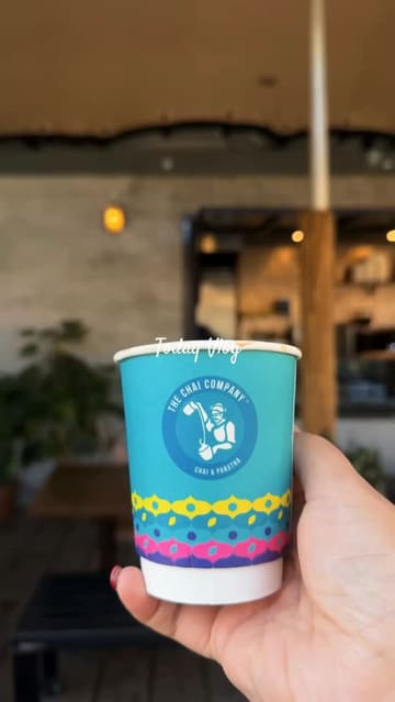 A vlog-style video showcasing a cafe in Bradford, highlighting the decor, menu, and chai preparation.