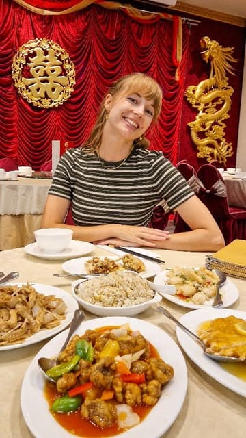 A review of Dragon's Delicacy, a Chinese restaurant, focusing on their extensive gluten-free menu options. The creator showcases several dishes including soft shell crab, crispy squid, and lemon chicken, providing a positive recommendation for those with dietary restrictions.