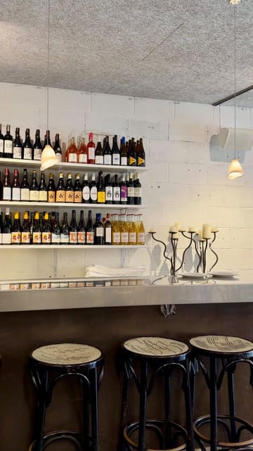 A short, aesthetic montage showcasing a series of seasonal dishes at Crispin in Clapham, set within the Studio Voltaire art space. The video focuses on the plating and presentation of the food, with a brief exterior shot of the venue.
