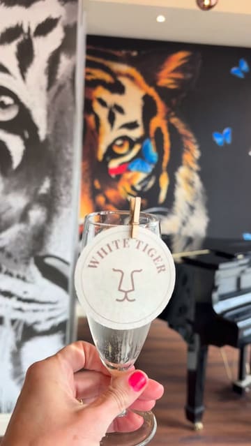 A fast-paced montage showcasing the launch party of White Tiger, an Indian restaurant in Liverpool. The video features clips of guests, live musical performances, a variety of canapés and drinks being served, and the venue's interior design.