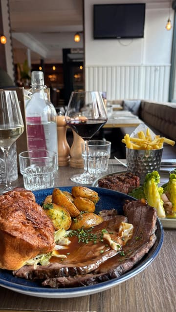 A montage-style review of a Scottish restaurant featuring various dishes like Cullen Skink, Sunday roast, and steak, alongside drinks and interior shots.