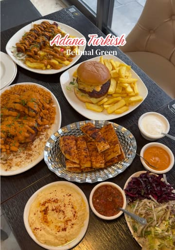 A short, fast-paced montage showcasing a variety of dishes and drinks at Adana Turkish Fusion in Bethnal Green, including hummus, kebabs, chicken, a burger, and cocktails.