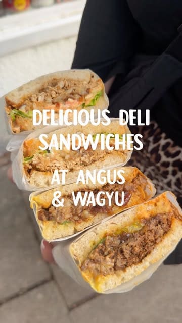 A promotional video showcasing deli sandwiches at Angus & Wagyu, featuring close-ups of the food preparation, the menu, and the shop exterior.