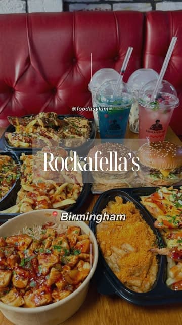 A fast-paced, visually engaging reel showcasing various 'Trap boxes,' rice boxes, burgers, and mocktails from Rockafella's in Birmingham. The video uses quick cuts and close-ups to highlight the textures and presentation of the food.