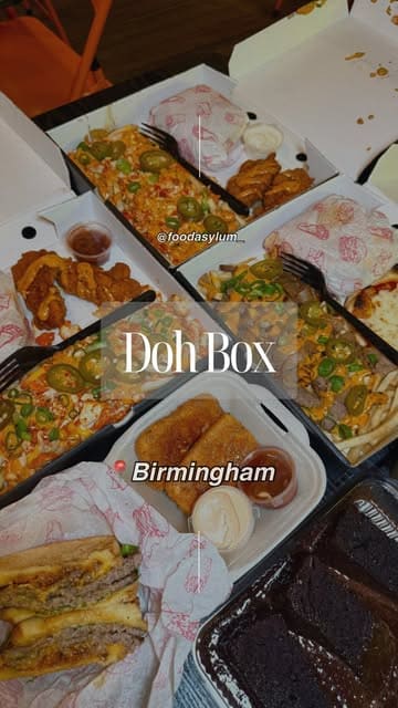 A fast-paced, music-driven video showcasing various 'munchboxes' from Doh Box, featuring close-ups of burgers, loaded fries, mozzarella sticks, and chocolate cake.