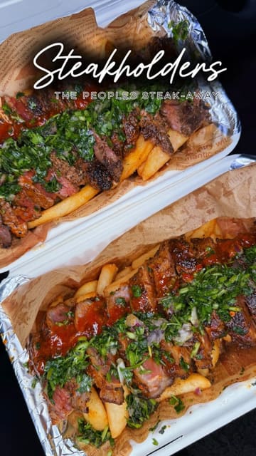 A short, POV-style video showcasing a steak and fries takeaway meal being eaten in a car. The video focuses on the visual appeal of the food, including close-ups of the steak and sauce being poured.