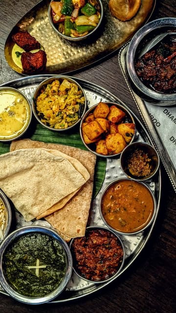 A promotional reel for Dhamroo in Oxford, featuring a variety of Indian dishes including a thali, pani puri, and various curries. The video highlights the restaurant's interior decor and the presentation of the food, using smooth, high-quality shots set to music.