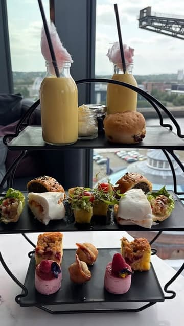 A montage showcasing an afternoon tea experience at Red Sky Bar, featuring a variety of savoury and sweet items, cocktails, and panoramic city views.