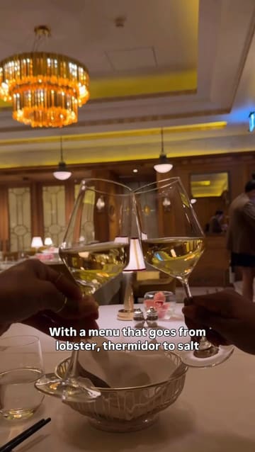 A short, energetic reel showcasing a visit to 6 Hamilton Place in Mayfair. The video features quick cuts of the restaurant's Art Deco interior, various plated dishes, and the creator enjoying the experience with a friend.