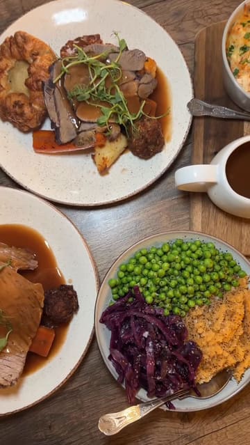 A montage of a Sunday roast meal at Bistro 8, featuring close-ups of various dishes including roast meats, sides, and desserts, with gravy and custard being poured over the food.