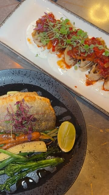 A short video review of The Sultan in Cardiff Bay, showcasing the restaurant's interior and a variety of dishes from their fixed menu, including meze, seabass, lamb sarma beyti, and desserts.