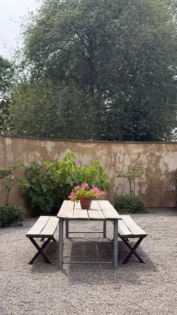 A short, aesthetic montage showcasing a pop-up cafe in a garden setting, featuring iced coffees, pastries, and outdoor seating.