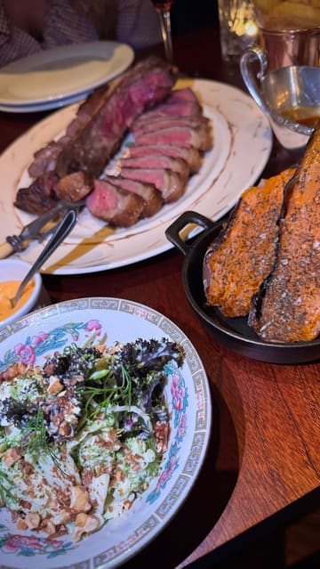 A montage video showcasing a visit to Blacklock restaurant, featuring shots of the exterior, the menu, the dining room, and various dishes including mushrooms on toast, ribs, a large porterhouse steak, and cheesecake.
