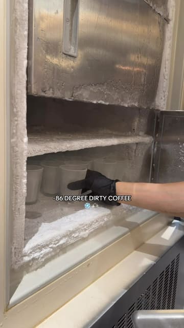 A short, informative video showcasing the preparation of a 'dirty coffee' at Onsu in London. The video follows the process from taking the cup out of a freezer to pouring the milk and espresso, followed by the creator tasting the drink.