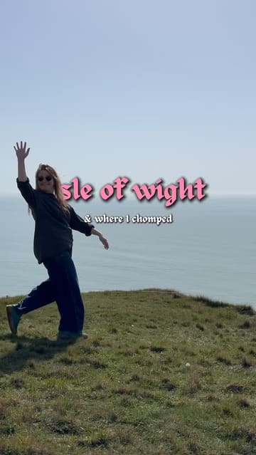 A vibrant travel vlog documenting a trip to the Isle of Wight, featuring visits to several popular hospitality venues including The Hut, The Beach Shack, and The George Hotel. The video combines scenic coastal shots, food close-ups, and personal moments to create an inviting atmosphere.