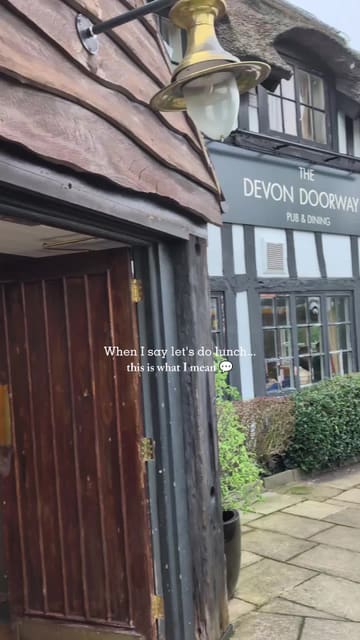 A short, engaging reel showcasing a visit to The Devon Doorway, a gastropub. The video features shots of the exterior, the cosy interior, and various dishes including scallops, steak, and salmon, with the creator enjoying the meal.