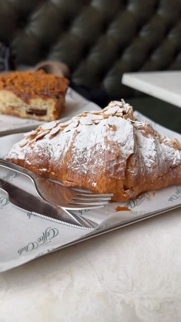 A montage-style video showcasing the interior, menu, and food offerings of Paragon Coffee Club in Glasgow. The video highlights the cozy decor, coffee, and pastries, with shots of the exterior and interior details.