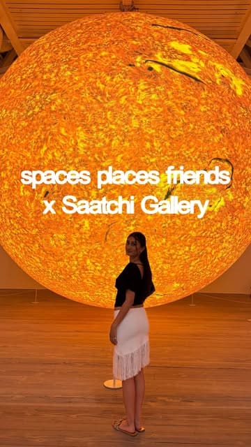 A vlog-style video showcasing a social event organized by 'Spaces Places & Friends' at the Saatchi Gallery, featuring a group of people exploring the 'The Sun and The Moon' art exhibition.