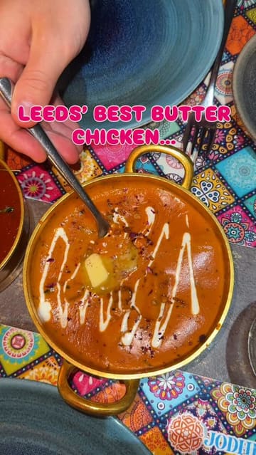A short, engaging review video of Jodhpur in Leeds, featuring close-up shots of their signature butter chicken, lamb curry, and sides, aimed at showcasing the restaurant's food quality.