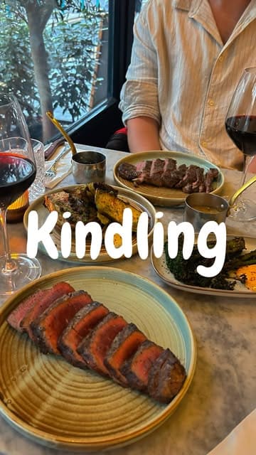 A review-style video showcasing a date night experience at Kindling restaurant in Brighton, featuring various dishes like steak, croquettes, and desserts.