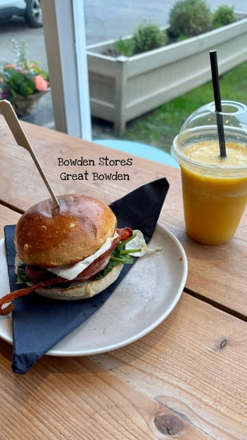 A montage video showcasing Bowden Stores, a cafe and homeware shop. The video features shots of the exterior, the interior dining area, close-ups of a burger and smoothie, and a tour of the retail shelves displaying various products.