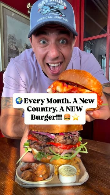 The video features a creator reviewing a monthly 'World Burger Tour' menu at The Royal Crown pub, specifically highlighting the Italian-themed 'Milan Meltdown' burger tray. The content includes shots of the pub exterior and interior, close-ups of the food, and the creator tasting the items.