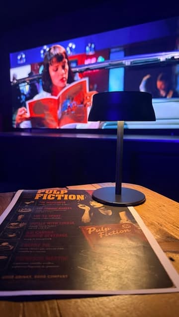 A promotional reel for 'The 3 Stories' in Sunderland, featuring their 'One Screen' movie event. The creator walks through the experience, highlighting the themed food and drink menu paired with a screening of Pulp Fiction. The video includes shots of the venue, the movie screen, and various courses served throughout the event.
