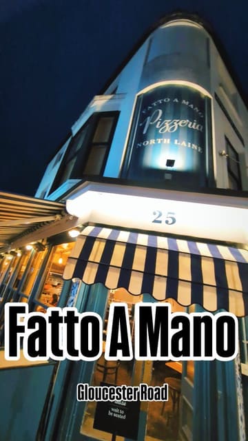A review of Fatto a Mano pizzeria, focusing on their controversial pineapple pizza special, 'Bella Disgrazia', which supports a local food charity.