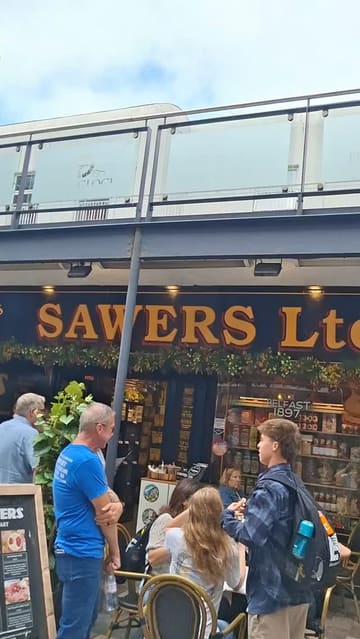 A video tour of Sawers deli in Belfast, showcasing their wide range of imported goods, local products, and deli counter offerings, followed by a brief review of a vegetarian sandwich and baklava.