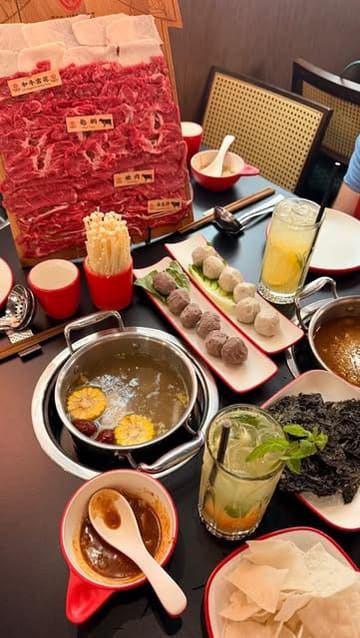 A personal 'come with me' style video showcasing a visit to Teo Hot Pot in Fitzrovia, highlighting the individual hot pot experience, the condiment bar, the premium beef platter, and the cocktail selection.