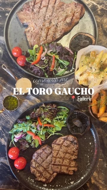 A top-down shot of a steak dinner featuring two plates with steaks, salad, and a side of fries. The image is clearly intended to showcase the meal at a steakhouse, using text overlay to identify the venue and location.