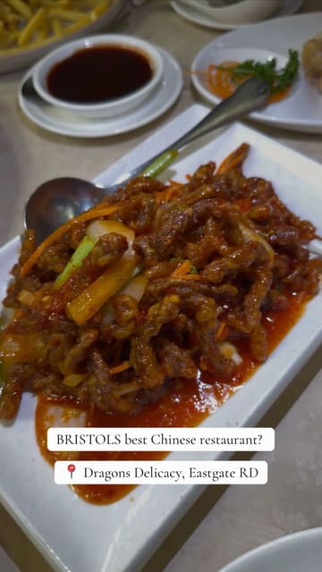 A review of Dragon's Delicacy in Bristol, showcasing the restaurant's interior and a variety of Chinese dishes including salt and chilli chips, prawn toast, salt and chilli chicken, crispy duck, and crispy chilli beef.