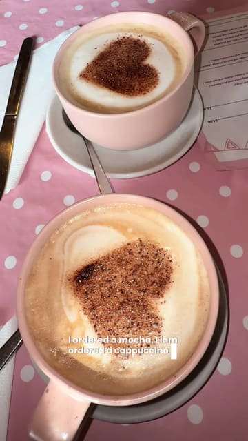 A short, handheld vlog review of 'Tea House on the Loch', highlighting the cafe's dog-friendly policy, menu options, and the surrounding scenic grounds. The video features shots of the exterior, interior, the dogs receiving treats, the menu, and the food served.