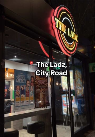 A review of The Ladz in Cardiff, featuring a variety of their menu items including smash burgers, peri chicken, loaded fries, lamb chops, and milkshakes.
