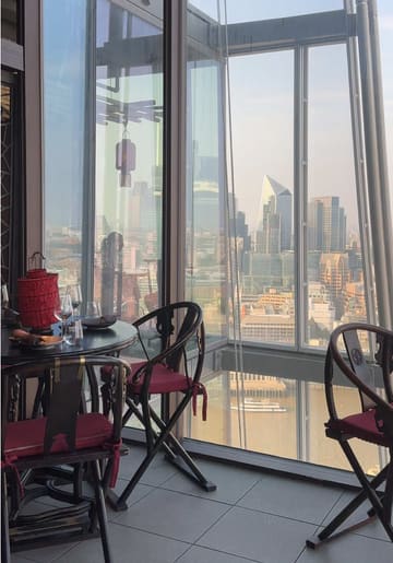 A montage showcasing the dining experience at Hutong in The Shard, featuring views of the London skyline, cocktails, and various Chinese dishes.