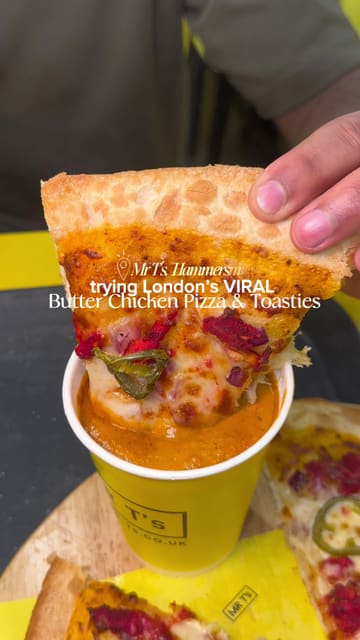 A fast-paced review of Mr T's in Hammersmith, highlighting their viral butter chicken pizza, loaded fries, toasties, and milkshakes. The video covers the ordering process via self-service kiosks and provides close-up shots of the food.