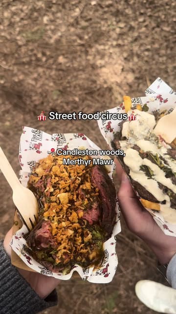 A vlog-style reel showcasing a visit to the Street Food Circus festival in Candleston Woods, featuring various food vendors, drinks, and the woodland atmosphere.