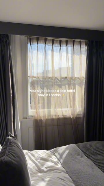 A short, handheld video tour of a hotel room at Eccleston Square Hotel in London, highlighting the room's features, bathroom amenities, and the view from the window.