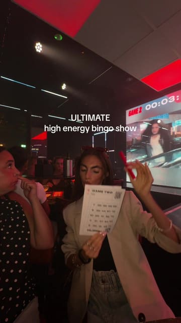A fast-paced, energetic reel showcasing a group of friends enjoying a night out at Hijingo, featuring clips of the venue's neon-lit aesthetic, gaming and bingo activities, and cocktails.