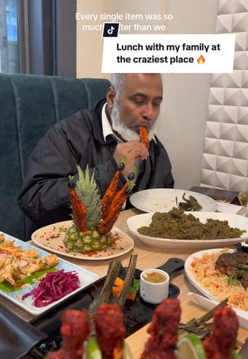 A vlog-style review of Rice Club in East Ham, highlighting the restaurant's interior, theatrical food presentation, and family-friendly environment, specifically noting its suitability for Iftar during Ramadan.