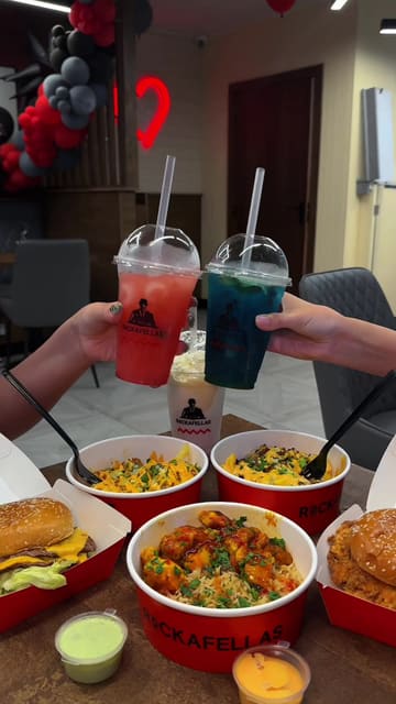 A promotional video for the grand opening of Rockafellas in Birmingham, highlighting the menu items including smash burgers, loaded fries, and a customisable salad bar.