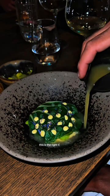 A review of the 'Immersive Journey to Scandinavia' tasting menu at Ekstedt at the Yard in London, highlighting the open-fire cooking techniques, hay-smoked dishes, and expert wine pairings.