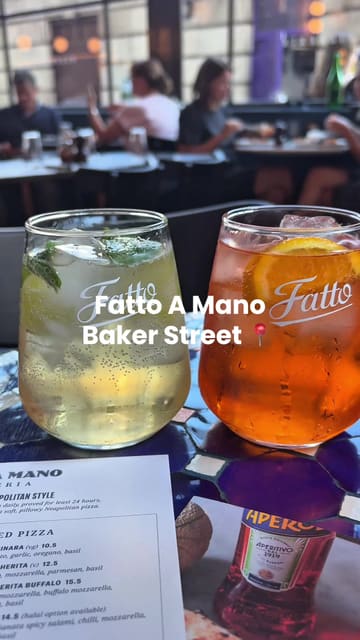 A 'come with me' style video featuring two friends visiting Fatto A Mano on Baker Street. The video captures the exterior, interior, a variety of small plates, pizzas, desserts, and cocktails, providing a comprehensive look at the dining experience.