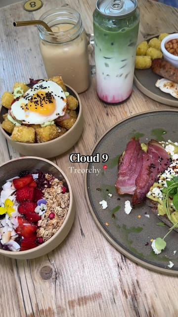 A vibrant and engaging review of Cloud 9 in Treorchy, featuring a tour of the cafe's aesthetic interior, a look at the menu, and close-ups of various breakfast and brunch dishes including an acai bowl, loaded tater tots, and avocado toast.