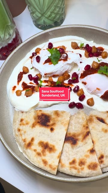 A visually appealing, slow-paced video showcasing the interior and new brunch menu items at Sana Soul Food. The video uses smooth pans and text overlays to describe the dishes, including matcha lattes, poached eggs, and roasted carrot flatbread.